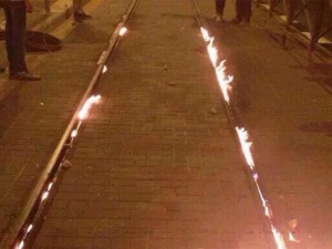 Arabs burn rubber and steel train tracks